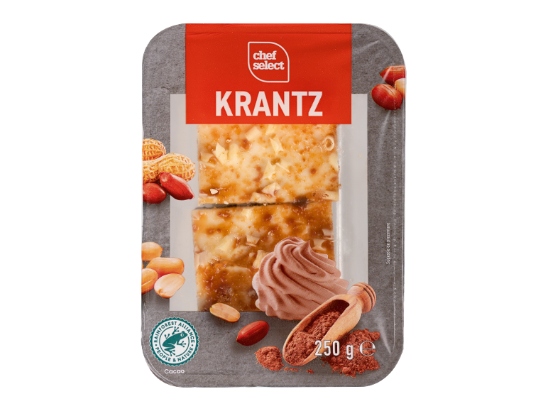 Bucăți de prăjitură cu nuci, glazură de caramel, alune și cacao.