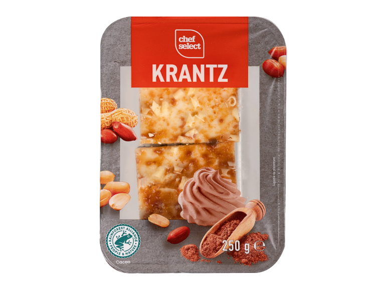 Bucăți de prăjitură cu nuci, glazură de caramel, alune și cacao.