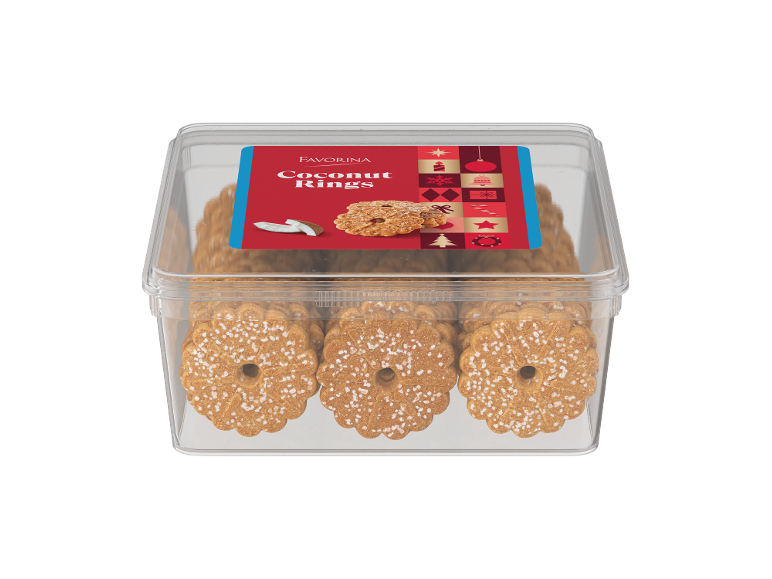 Inele de cocos într-un recipient transparent din plastic cu o etichetă roșie cu tematică de Crăciun.