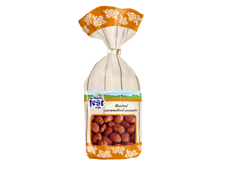 Ambalaj de arahide caramelizate cu motiv floral și fundal din lemn.