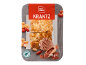 Bucăți de prăjitură cu nuci, glazură de caramel, alune și cacao.