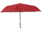 Umbrelă roșie cu model geometric și mâner argintiu.