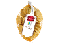 Monede de ciocolată aurii într-o plasă, cu etichetă de ciocolată cu lapte Fairtrade.