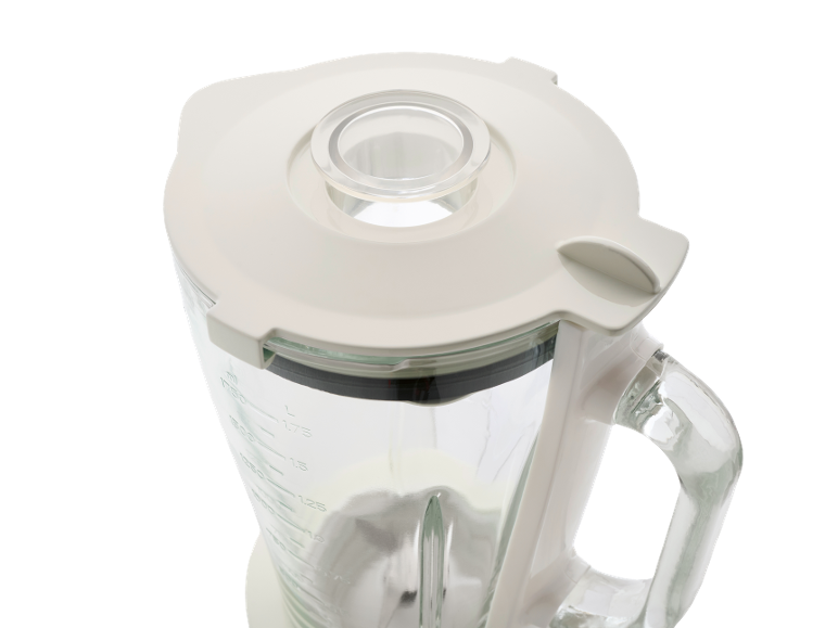Partea superioară a unui blender cu capac alb și măsurător de lichide.