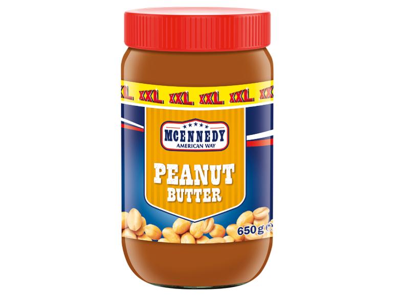 Borcan de unt de arahide cu capac roșu, eticheta scrie „Peanut Butter” și „650ge”.