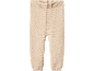 Pantaloni tricotati bej pentru bebeluși, cu talie și manșete striate.