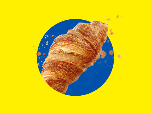 Un croissant auriu, crocant, pe un fundal galben cu un cerc albastru.