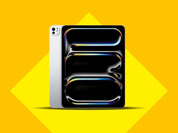 O tabletă argintie cu ecran negru, cu forme abstracte luminoase, pe un fundal galben.